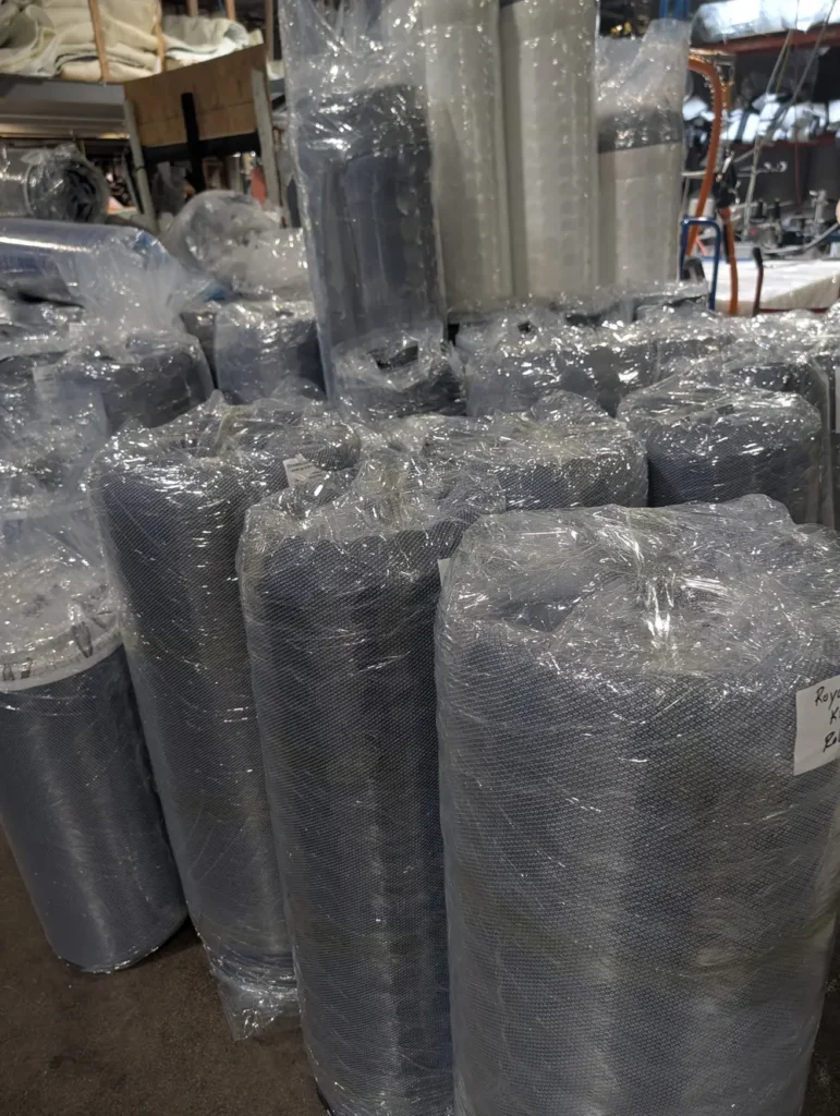 Mattresses in North York, compressed and rolled for efficient delivery